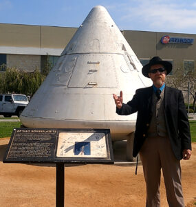 Andrew Ledford Speaking In Front of Space capsule.